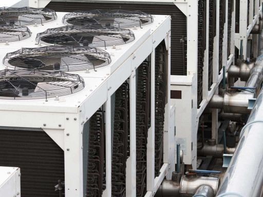 Close up of a roof with fans on top.