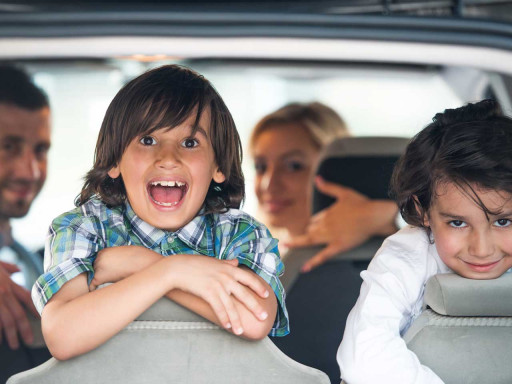 Children and parents in a car.