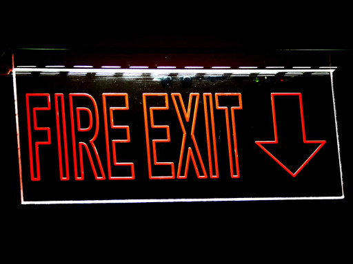 Close up of fire exit in red.